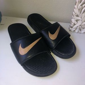 Men’s black and gold swish Nike slides
